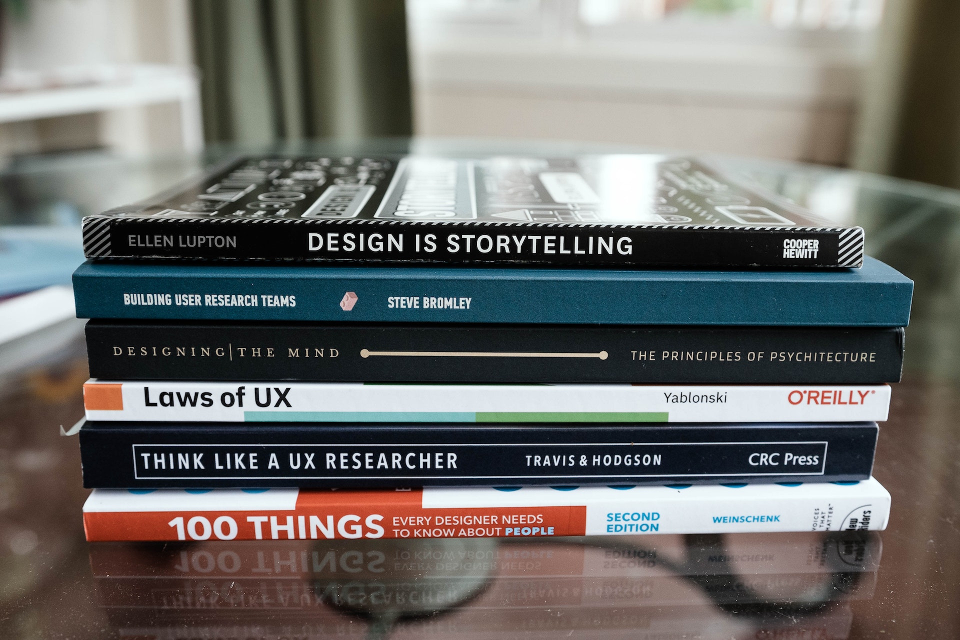 Image of a stack of UI/UX books to read