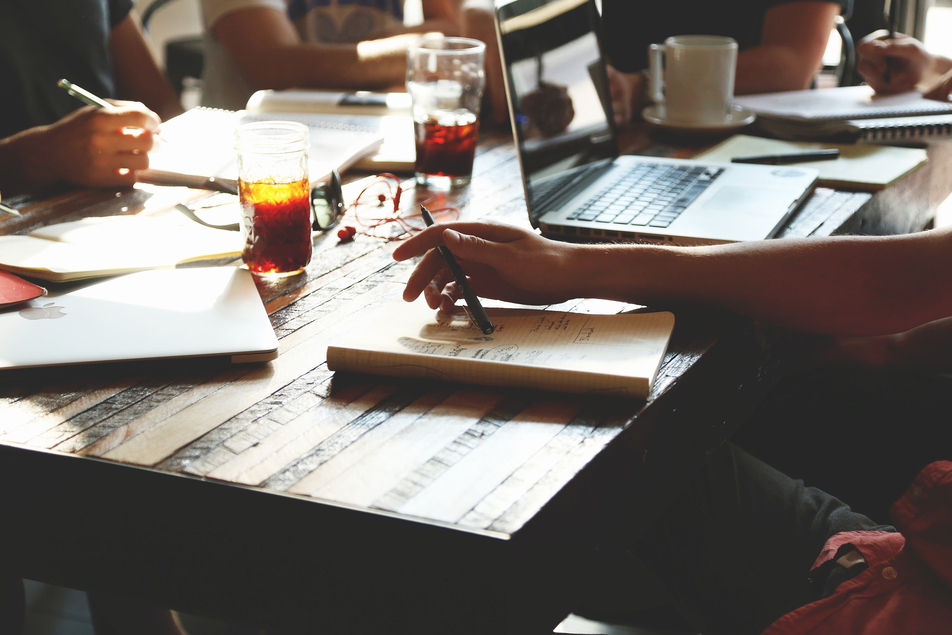 Image of person working on a notebook